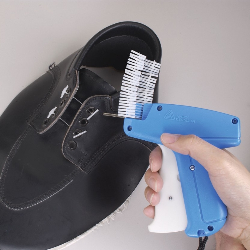 Light Blue Extra Heavy-Duty Hand Tool attaching fasteners to black shoe